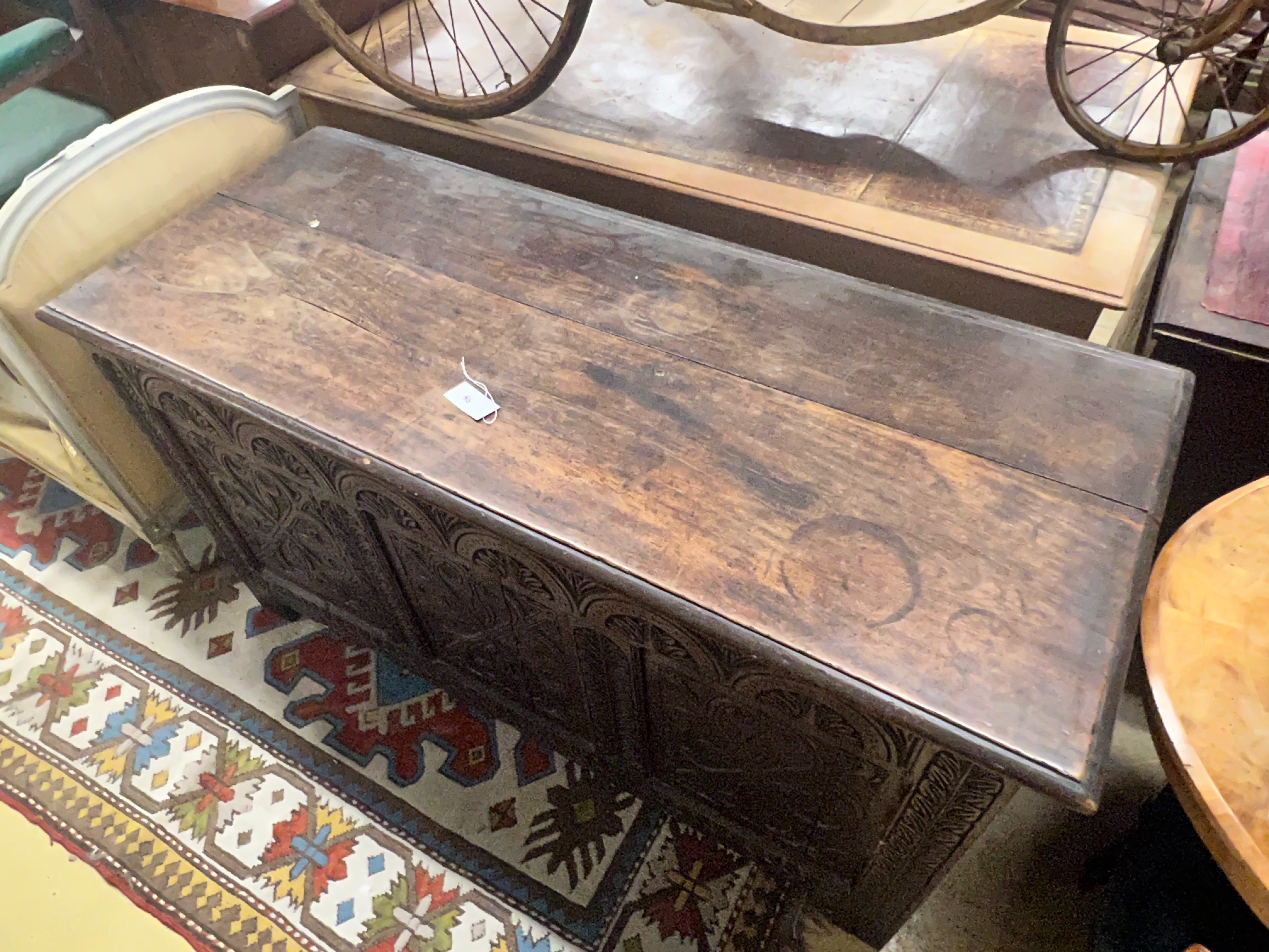 A large 18th century carved oak coffer, width 143cm depth 59cm height 77cm